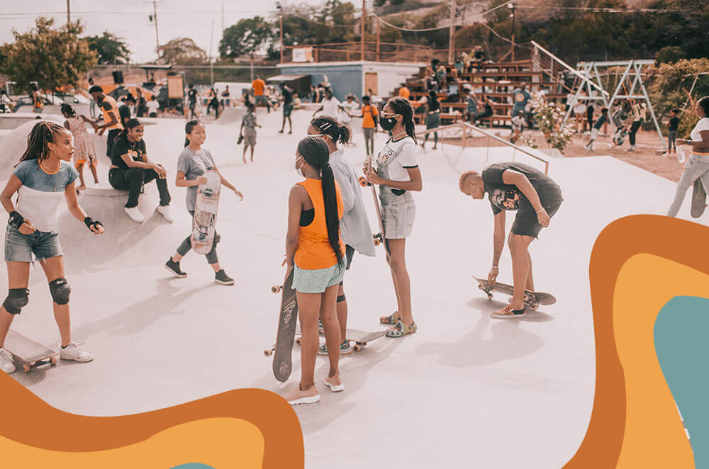 Girls skateboarding at the Freedom Skatepark in Jamaica